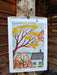 2026 Wild Earth Studio calendar with nature-themed design on a wooden background