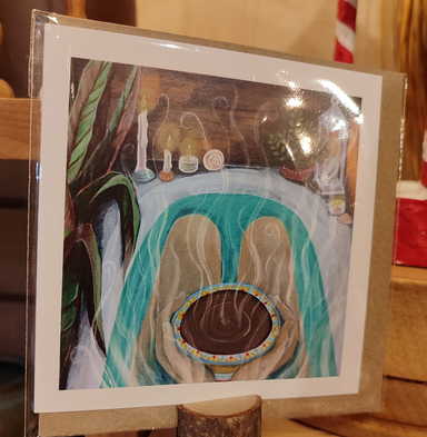 Artistic depiction of a foot bath with candles and plants on a card. Artistic depiction of a hot chocolate bowl with steam, surrounded by candles and plants.  Me Time - self care, mindfulness card