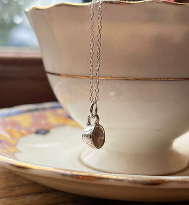 Tiny silver teacup necklace with on a saucer with a teacup, mindful gift thich Nhat Hanh