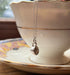 Tiny silver teacup necklace with on a saucer with a teacup, mindful gift thich Nhat Hanh