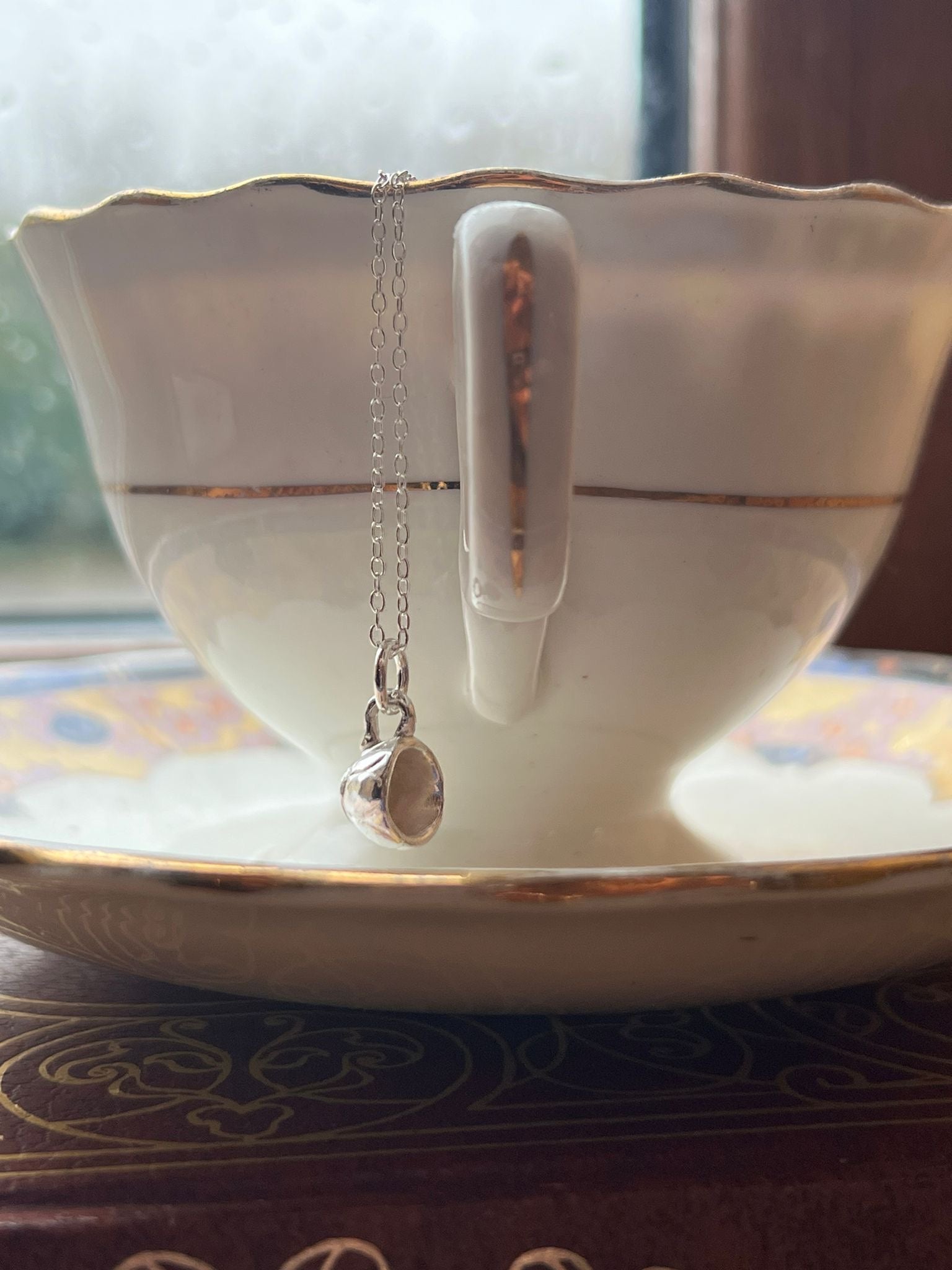Handmade Irish silver tiny teacup necklace inspired by mindful tea drinking