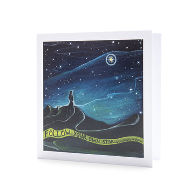 Figure against night sky looking a the bright star of guidance and encouragement to follow your own path, graduation card, new chapter , time of change, mindful art